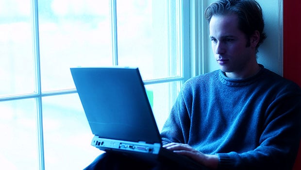 Screenwriter sitting and typing his screenplay. 